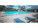 Inviting community pool with lounge chairs and surrounding patio at 4367 White Pine Ave # 4, Orlando, FL 32811