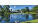Serene community lake view with fountain and reflecting trees at 4367 White Pine Ave # 4, Orlando, FL 32811