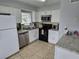 Bright kitchen featuring granite countertops and stainless steel appliances at 4367 White Pine Ave # 4, Orlando, FL 32811