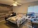Cozy bedroom with wood-look wall and en-suite bathroom at 4367 White Pine Ave # 4, Orlando, FL 32811