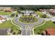 Aerial view of community with homes, landscaping, and roads at 2669 Santosh Cv, Kissimmee, FL 34746
