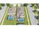 Aerial view of two houses with private pools in a residential area at 2669 Santosh Cv, Kissimmee, FL 34746