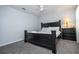 Bedroom with king-size bed, nightstand, and ceiling fan at 2669 Santosh Cv, Kissimmee, FL 34746