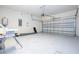 Spacious garage with ample storage space and overhead door at 2669 Santosh Cv, Kissimmee, FL 34746