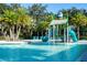 Community pool with water features and slide at 2669 Santosh Cv, Kissimmee, FL 34746