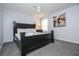 Spacious bedroom with king-size bed, artwork, and ceiling fan at 2669 Santosh Cv, Kissimmee, FL 34746