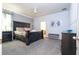 Spacious main bedroom with plush carpeting and an ensuite bathroom at 2669 Santosh Cv, Kissimmee, FL 34746