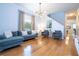 Bright living room with hardwood floors, comfortable seating, and natural light at 2669 Santosh Cv, Kissimmee, FL 34746