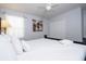 Primary bedroom with king-size bed, white linens, and closet at 2669 Santosh Cv, Kissimmee, FL 34746