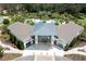 Community pool with modern clubhouse and landscaping at 2669 Santosh Cv, Kissimmee, FL 34746