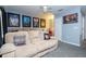 Home theater room with comfortable seating, movie posters, and a popcorn machine at 2669 Santosh Cv, Kissimmee, FL 34746