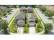 Aerial view of a residential neighborhood with houses and streets at 2669 Santosh Cv, Kissimmee, FL 34746