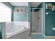 Bathroom with soaking tub, shower stall, and updated fixtures at 112 Paloma Dr, Davenport, FL 33837