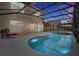 Stunning pool and spa at dusk with illuminated water features at 112 Paloma Dr, Davenport, FL 33837