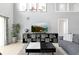 Spacious living room with sectional sofa and large TV at 112 Paloma Dr, Davenport, FL 33837