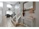 Bright entryway with staircase, console table, and mirror at 112 Paloma Dr, Davenport, FL 33837