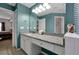 Bathroom boasts granite countertops and double sinks at 112 Paloma Dr, Davenport, FL 33837