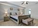 Main bedroom featuring a comfortable bed and ensuite access at 112 Paloma Dr, Davenport, FL 33837