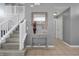 Entryway with staircase and console table at 112 Paloma Dr, Davenport, FL 33837