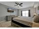Spacious main bedroom with large bed and ceiling fan at 112 Paloma Dr, Davenport, FL 33837