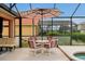 Enjoy dining alfresco on this covered patio at 112 Paloma Dr, Davenport, FL 33837