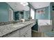 Bathroom with granite vanity and a relaxing soaking tub at 112 Paloma Dr, Davenport, FL 33837