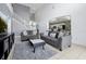 Open living room with sectional sofa and view into kitchen at 112 Paloma Dr, Davenport, FL 33837