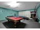 Entertain in this game room featuring a pool table and ping pong at 112 Paloma Dr, Davenport, FL 33837