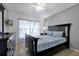 Bedroom with a king-size bed and plenty of natural light at 112 Paloma Dr, Davenport, FL 33837