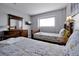 Bedroom with twin beds and wood furniture at 112 Paloma Dr, Davenport, FL 33837