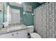 Bathroom with granite countertop, white vanity, and shower at 112 Paloma Dr, Davenport, FL 33837
