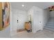 Bright and airy entryway with stylish storage and staircase at 6201 Chorus Dr, Mascotte, FL 34753