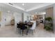 Modern kitchen with island and stainless steel appliances, open to the dining area at 6230 Chorus Dr, Mascotte, FL 34753
