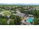 Community clubhouse and pool with lounge chairs at 6115 Sunset Isle Dr, Winter Garden, FL 34787