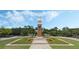 Attractive clock tower in the center of a landscaped community at 6115 Sunset Isle Dr, Winter Garden, FL 34787
