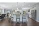 Open kitchen with island, granite countertops, and stainless steel appliances at 6115 Sunset Isle Dr, Winter Garden, FL 34787