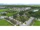 Community green space with roads and landscaping at 6115 Sunset Isle Dr, Winter Garden, FL 34787