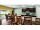 Kitchen with dark cabinets, island, and access to backyard at 205 Hamlet Rd, Davenport, FL 33837