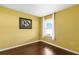 Bright bedroom with wood floors, a window, and neutral-colored walls at 205 Hamlet Rd, Davenport, FL 33837