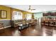 Open living room with hardwood floors and a view of the kitchen at 205 Hamlet Rd, Davenport, FL 33837
