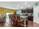 Modern kitchen with dark wood cabinets, granite countertops, and island at 205 Hamlet Rd, Davenport, FL 33837
