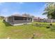 Spacious backyard with screened lanai, firepit, and shed at 897 Vicksburg St, Deltona, FL 32725