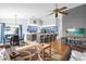 Open floor plan living room with brown couches and large TV at 897 Vicksburg St, Deltona, FL 32725