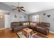 Spacious living room featuring a large sectional sofa and wood floors at 897 Vicksburg St, Deltona, FL 32725