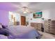 Main bedroom with large bed and dresser, plus en-suite bathroom at 897 Vicksburg St, Deltona, FL 32725