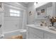 Clean bathroom with a tub, shower, and updated vanity at 897 Vicksburg St, Deltona, FL 32725
