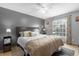 King-size bedroom with ceiling fan and gray walls at 897 Vicksburg St, Deltona, FL 32725