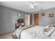Comfortable bedroom with a queen bed and wood floors at 897 Vicksburg St, Deltona, FL 32725