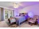 Bright bedroom with a king bed and relaxing sitting area at 897 Vicksburg St, Deltona, FL 32725