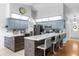 Modern kitchen with blue cabinets, marble countertops, and stainless steel appliances at 897 Vicksburg St, Deltona, FL 32725